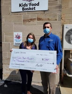 man presenting giant check to woman